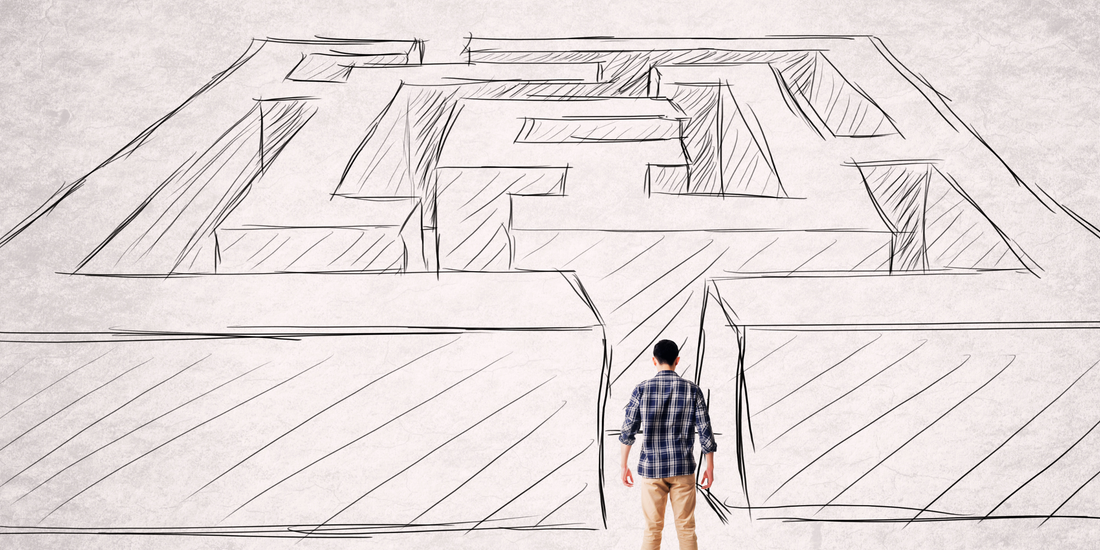 Man standing in front of a penciled mazed